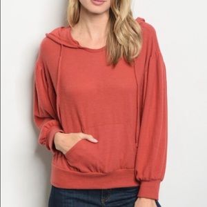 Long sleeve scoop neck pull over knit top.
